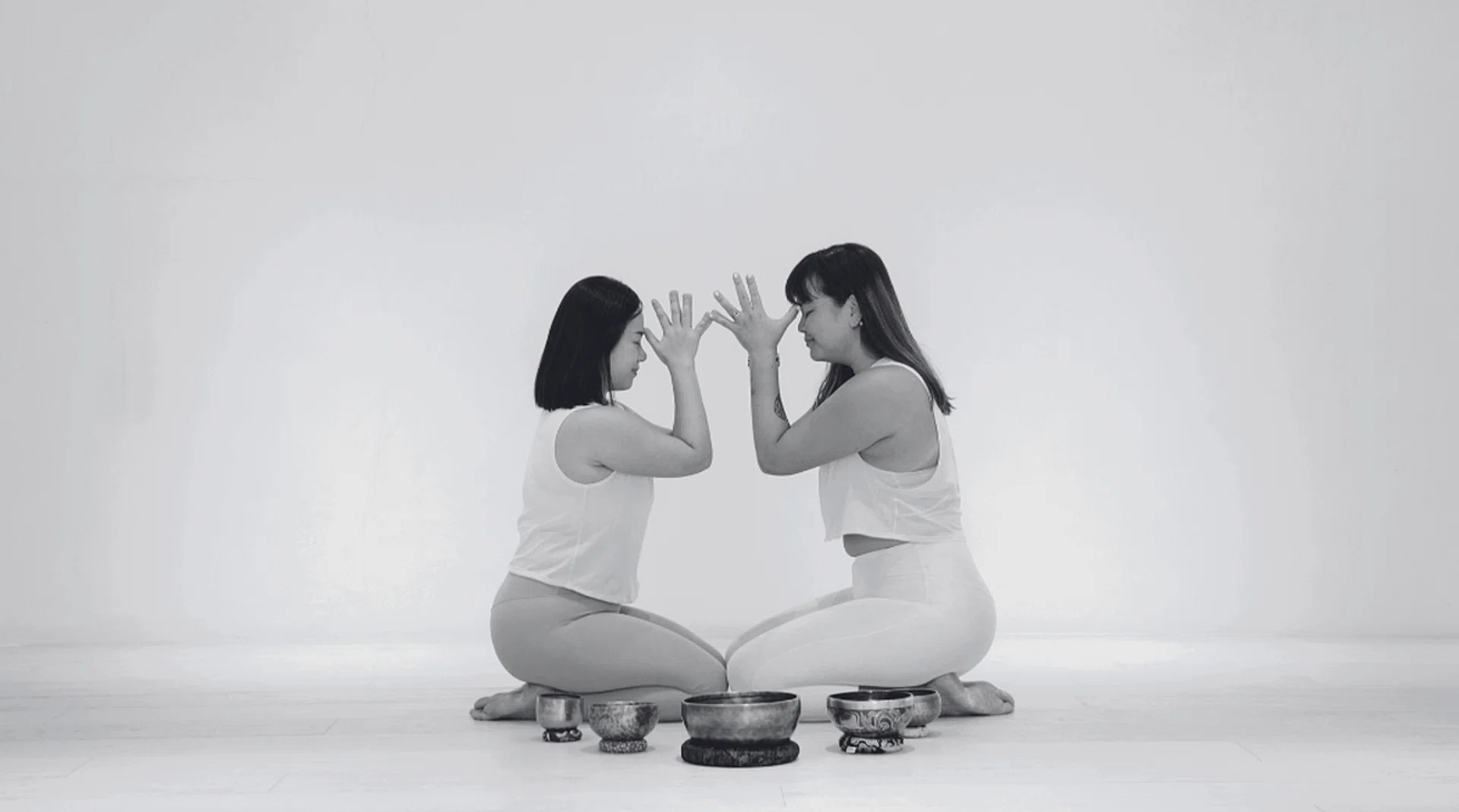 Yoga practitioners Angeline Chia (left) and Meiyan Cheong combine elements of sound healing, meditation and manifestation.