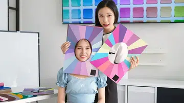 Colour consultant analysing skin tone undertones during consultation