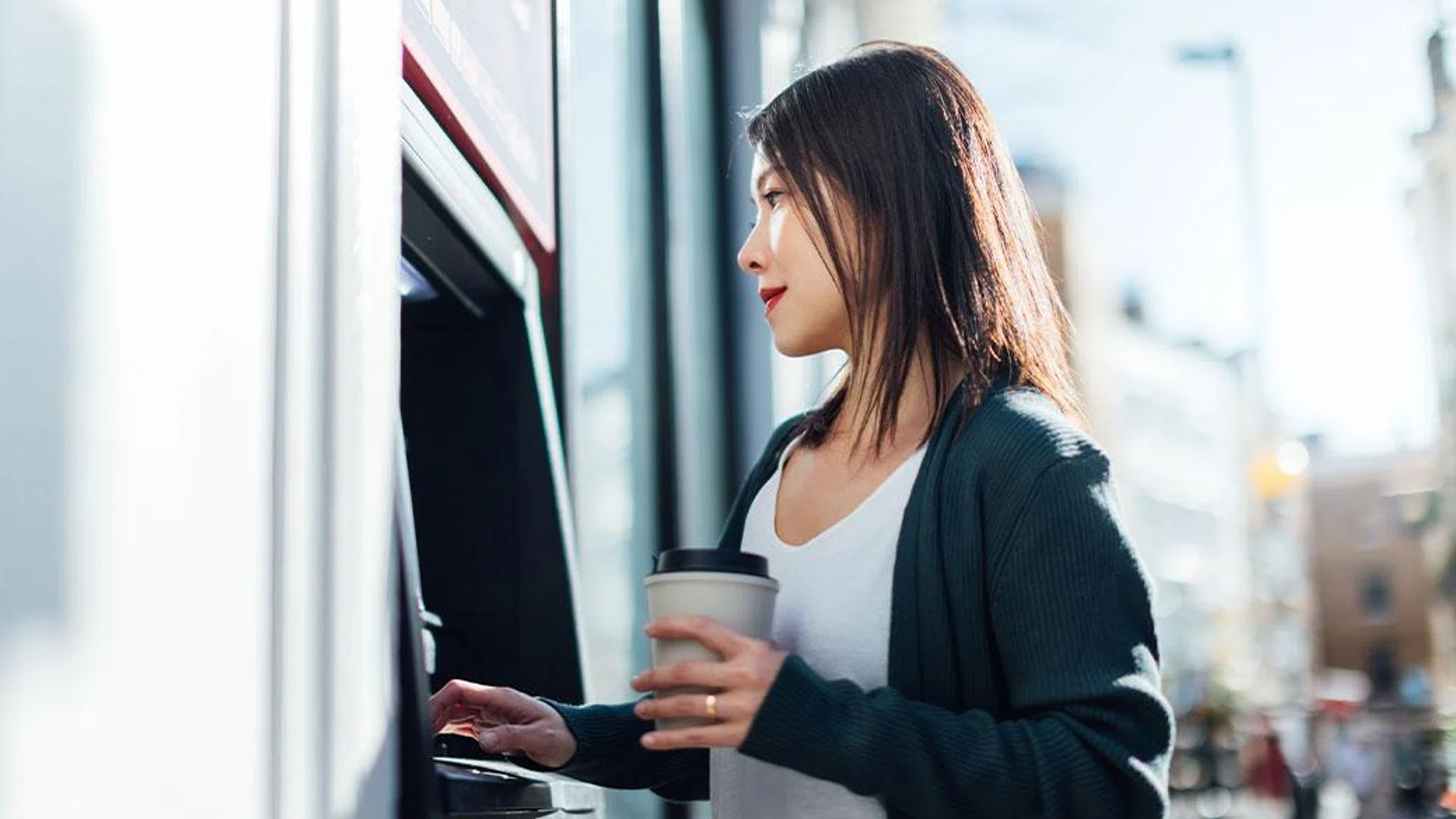 woman withdrawing money bank | Year of the Fire Horse: Youre 2026 wealth forecast 