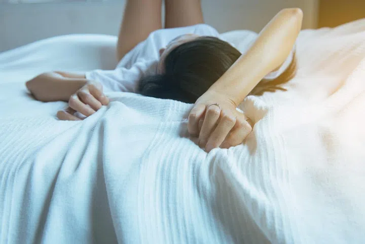 Close up of hand woman sign orgasm,Finger female pulling white bedsheet,Concept of sexual relations