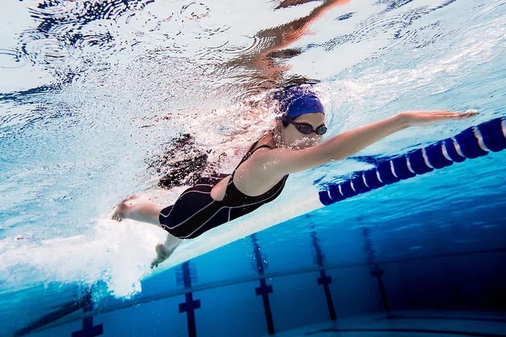 Woman swimming pool.Underwater photo