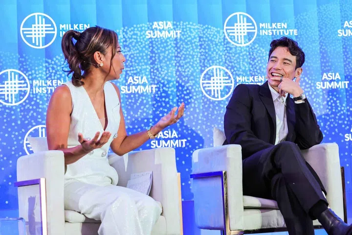 Manny Jacinto answers a question from moderator Haslinda Amin. (Credit: Milken Asia Summit)