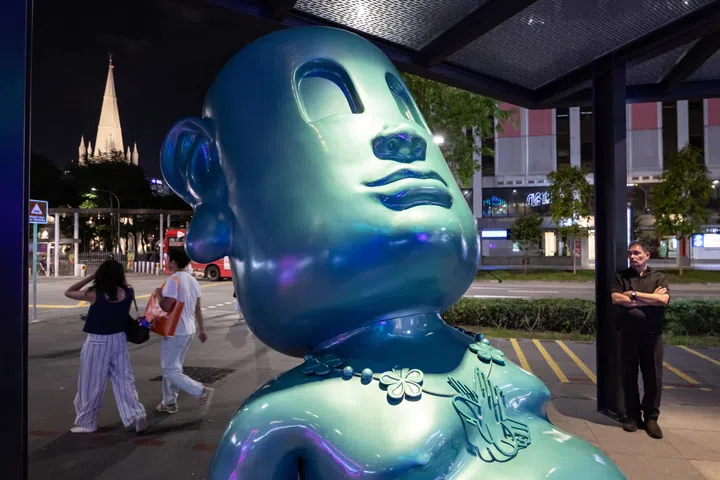 ST20250819_202503000510/shnight20/Brian Teo/Shawn Hoo/Overview of KU a Dreamer, an installation by Vietnamese visual artist and creative director Tung Monkey, outside Funan mall on Aug 19, 2025. The work reflects on the pace of modern life, asking whether we still make time to dream. KU is depicted at rest, enclosing his dreams in a box and contemplating them. As the world rushes by, he invites passersby to pause, observe their surroundings, and let go of their anxieties. ST PHOTO: BRIAN TEO 