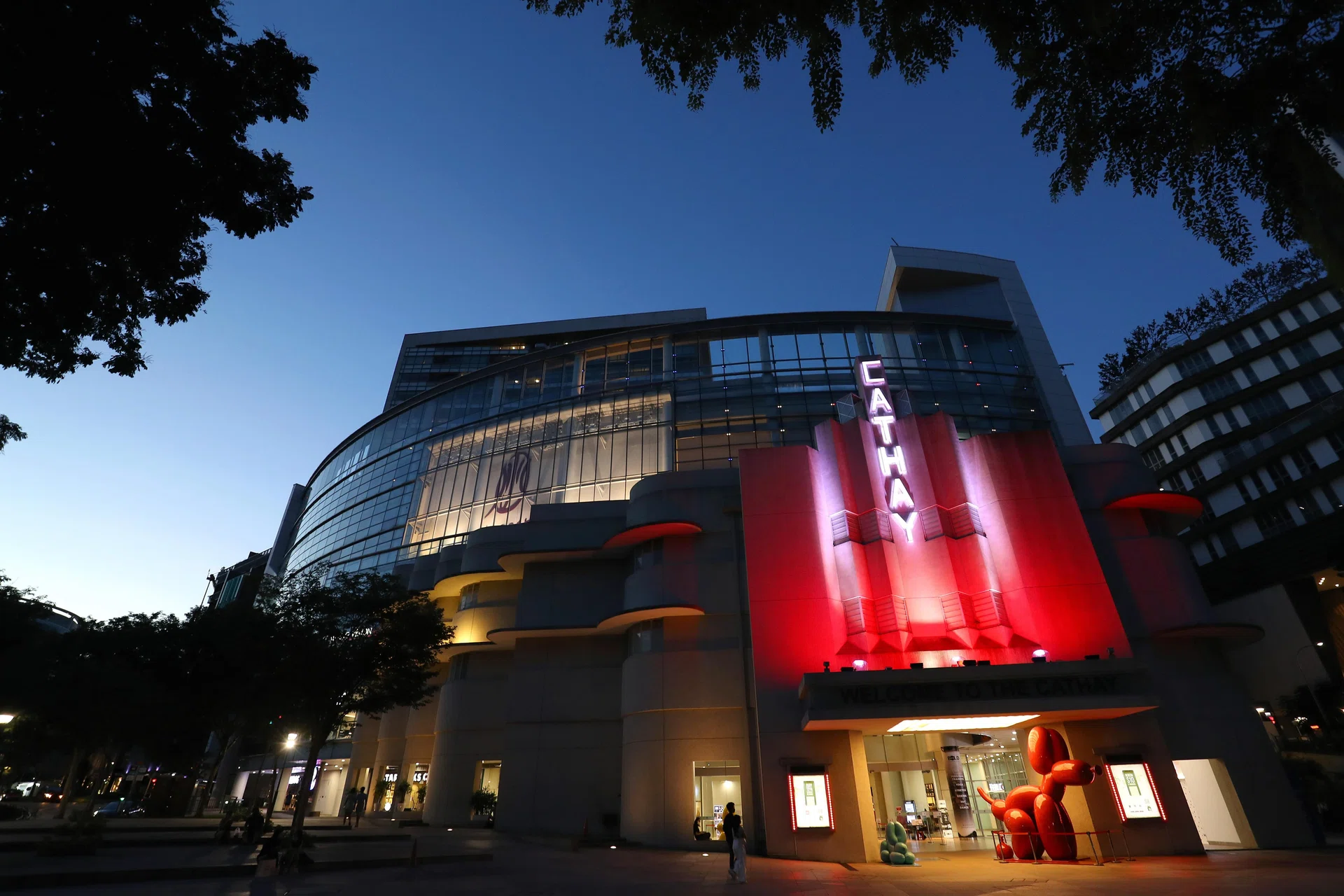 SINGAPORE - 2021/08/01: The Cathay is lit up in red and white in Singapore. 
Seven cultural and historical buildings in the Bras Basah-Bugis precinct will be lighted in the colours of the national flag in the month of August as Singapore celebrates her 56th birthday on August 9th, 2021. (Photo by Lionel Ng/SOPA Images/LightRocket via Getty Images)