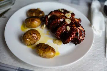 Traditional Portuguese Grilled Octopus (Polvo Grelhado). (photo by: Nano Calvo/VWPics/Universal Images Group via Getty Images)