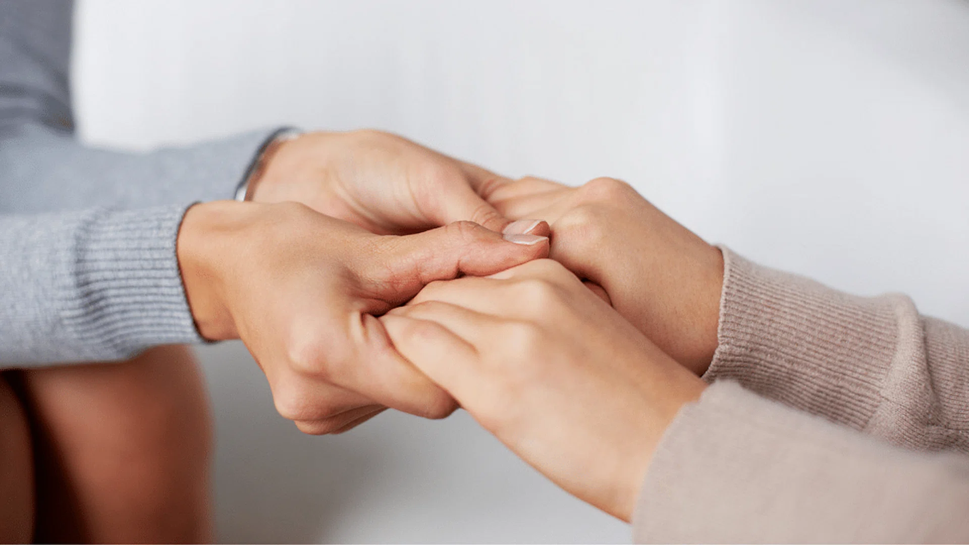 caring holding hands