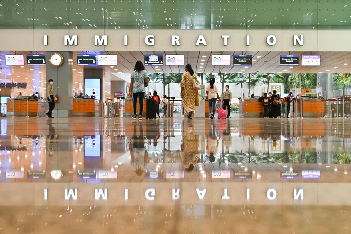 Passengers clearing immigration at the arrival hall of Changi Airport Terminal 3 on March 29, 2022.