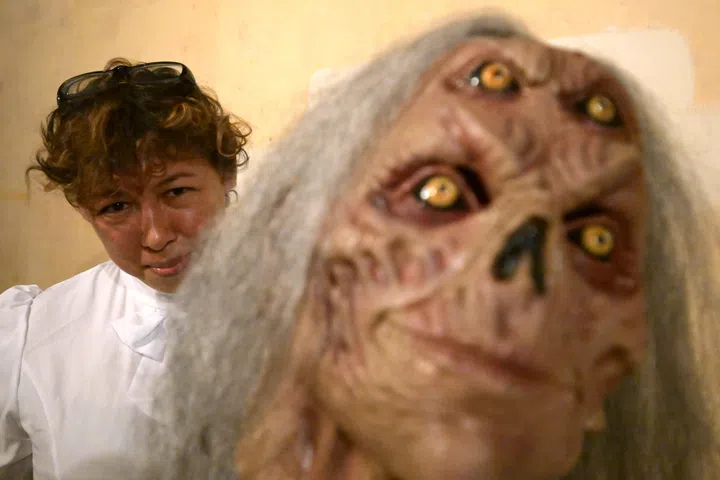 kxhalloween27/ST20240907_202487000878/Ng Sor Luan/Interview with scare actors for Halloween. Arts manager, Eliyah Osman, 52, with her mask. 