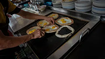 SELANGOR, INDONESIA - AUGUST 16: A chef makes Roti Canai before frying it on the cooking pan. This way of cooking the traditional dish is one of the special attractions of Hatinie Restaurant located in Shah Alam City, Selangor, Malaysia on August 16, 2020. (Photo by Syaiful Redzuan/Anadolu Agency via Getty Images)