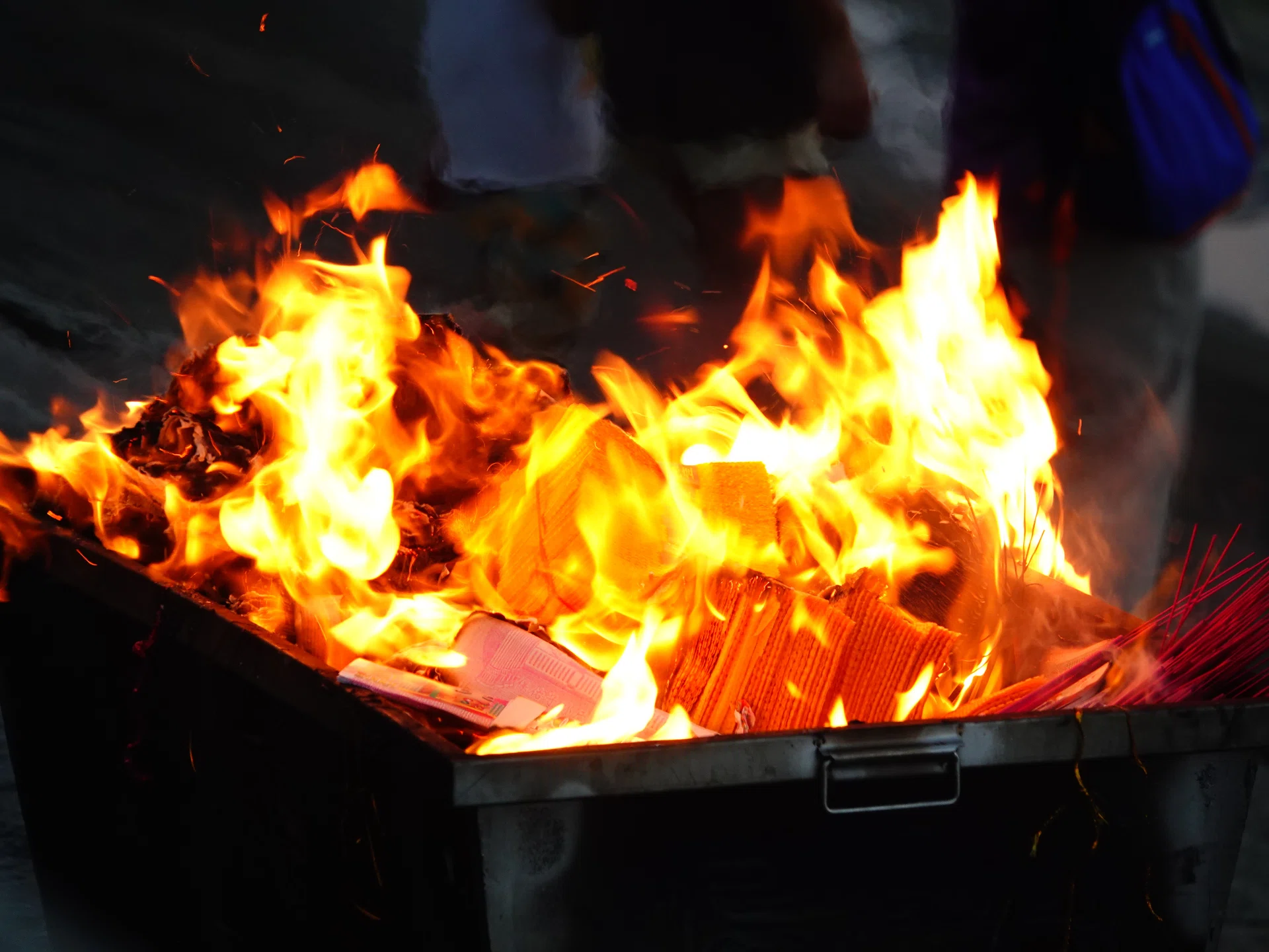 People are burning paper money to offer sacrifices to their ancestors during the Hungry Ghost Festival in Yichang, China, on August 16, 2024. (Photo by Costfoto/NurPhoto via Getty Images)