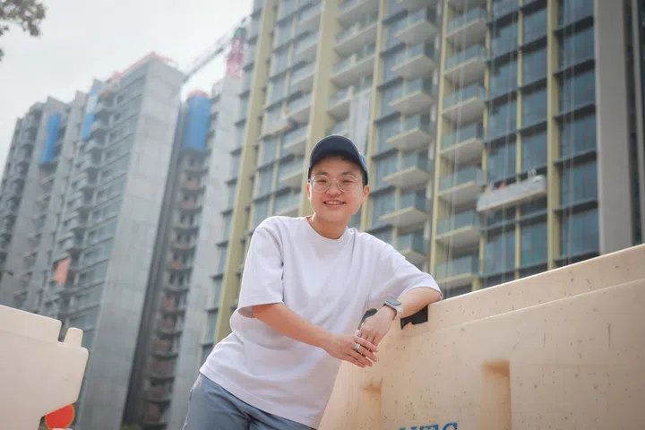 ST20260422_202641200896/jlyoung/Joyce Lim/Jason Quah

Teri Tan, 32, who bought a unit at Pinetree Hill (background), pictured April 22, 2026. ST PHOTO: JASON QUAH