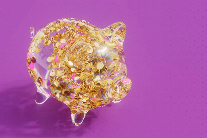 Digitally generated image of glowing glass piggy bank with gold dollar coins. Concept of fintech technology, new banking and savings.