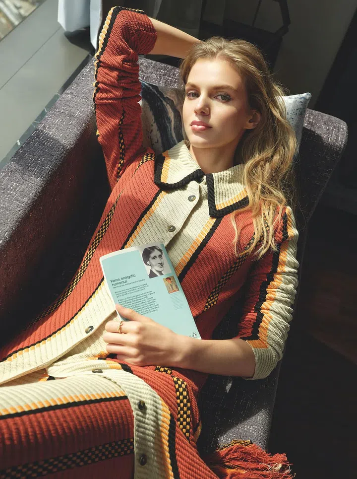 Knit dress and matching fringed skirt, Tod’s. Tiffany Knot yellow gold ring with diamonds, Tiffany & Co.