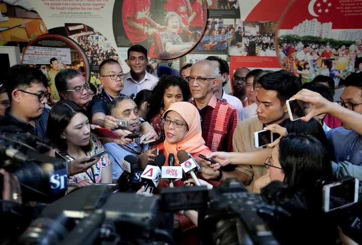 Mdm Halimah Yacob, who was surrounded by journalists and photographers after being announced as the sole presidential candidate on the Candidate Nomination Day, said she would serve vigorously, and work hard, passionately and committed as has been shown over the last four decades. Photos of the Nomination Day proceedings are attached for your use. Please attribute them to MCI’s official photographer.