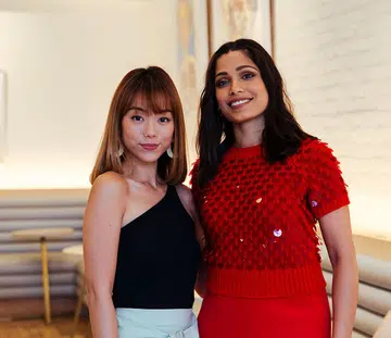 Andrea Chong and Freida Pinto