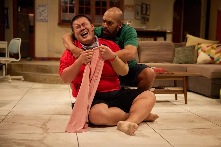 clfalling10 - Bill (background, Dwayne Lau) hugs Josh (foreground, Andrew Marko) as he cries after a violent outburst. Source: CRISPIAN CHAN