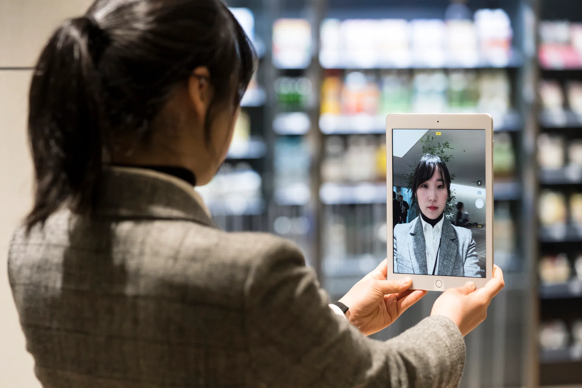 TOKYO, JAPAN - FEBRUARY 28: An employee demonstrates the facial recognition system for the NEC SMART STORE at the NEC Corporation headquarters on February 28, 2020 in Tokyo, Japan. NEC Corp. opened the NEC SMART STORE, a cashier-less convenience store this February to showcase their smart retail systems including a camera and image recognition technology installed in the store that allows customers to make payments without going through cashiers. (Photo by Tomohiro Ohsumi/Getty Images for NEC Corporation)