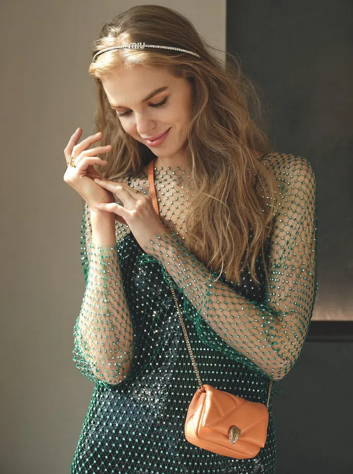 Sequinned slip dress (worn underneath) and embellished headband, Miu Miu. Sequinned dress, H&M. Serpenti Cabochon mini handbag, Bvlgari. Tiffany T T1 rose gold ring with diamonds, Tiffany & Co.