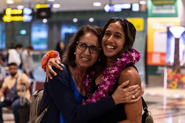 ST20240905_202488700222/kkath05/Brian Teo/Kimberly Kwek MR/ National sprinter Shanti Pereira embracing her mother Jeet Pereira, 64, at Changi Airport Terminal 3 on September 5, 2024. ST PHOTO: BRIAN TEO.