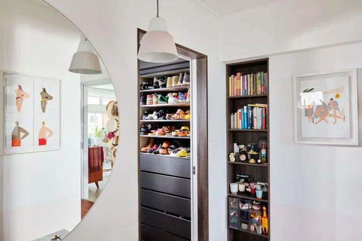 The master bedroom was redesigned to serve as a spacious, fully functional walk-in wardrobe.Photo: Gan
