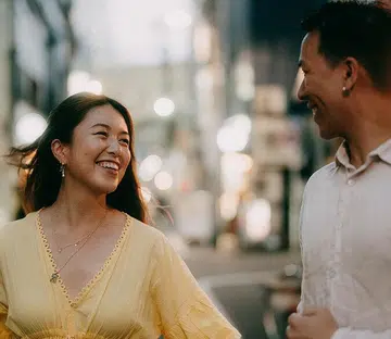 couple holding hands smiling | Year of the Fire Horse your 2026 CNY relationship forecast