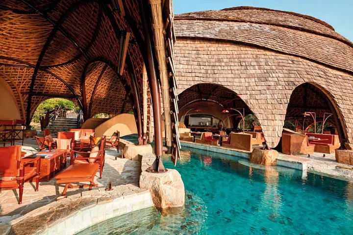 At the Wild Coast Tented Lodge, the dome-shaped Ten Tuskers bar and Dining pavilion mirror the boulders scattered across the golden beach beyond.