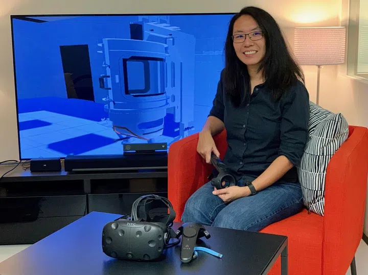 Associate Professor Jeannie Lee from the Singapore Institute of Technology demonstrating a virtual-reality simulation for training of bioreactor operations. She is deputy director of SIT’s Centre for Immersification, a research lab. 
