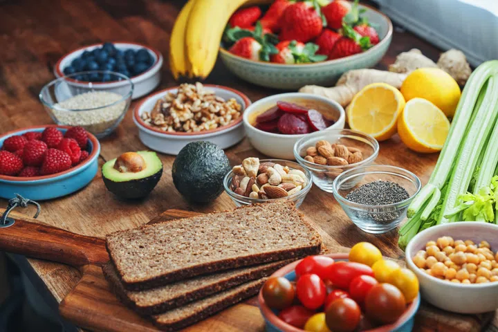 Trending Foods - Superfoods: Preparing Avocado Toast with Whole Grain Bread and Superfood Toppings