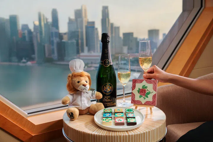 The SG60 stay package at  Ritz-Carlton Millenia Singapore comes with goodies like a limited-edition lion plush toy, a bottle of champagne and chocolates.
