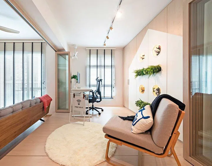 Cabinets flanking the display area and storage units within the platform are part of the storage solutions needed for a small home like this.