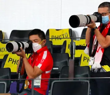 Mr Tan Chuan-Jin (left) and Mr Edwin Tong have coupled their ardent support for Team Singapore with their passion for photography.