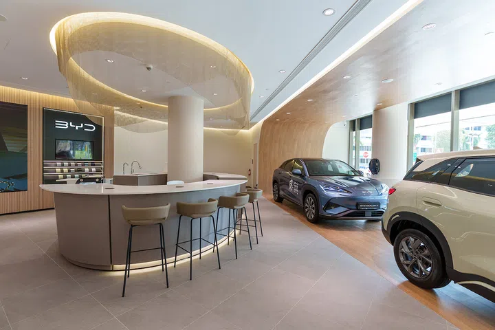 The BYD Tampines 1 showroom features a curved design centred around a coffee bar, with space for events and to display up to three vehicles.