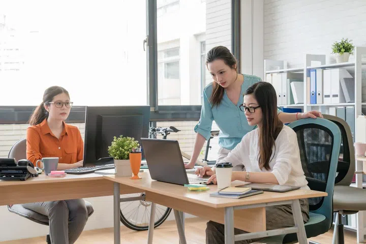 Business asia people group are using gadgets, discussing documents and smiling during the conference