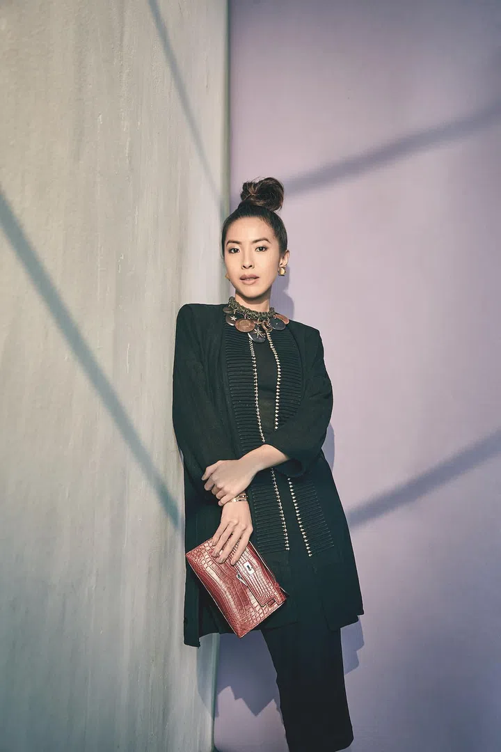 Sabrina got this cool linen coat with metal detail on a trip to Vietnam. She usually styles it with a simple dress, statement necklace and stylish clutch.