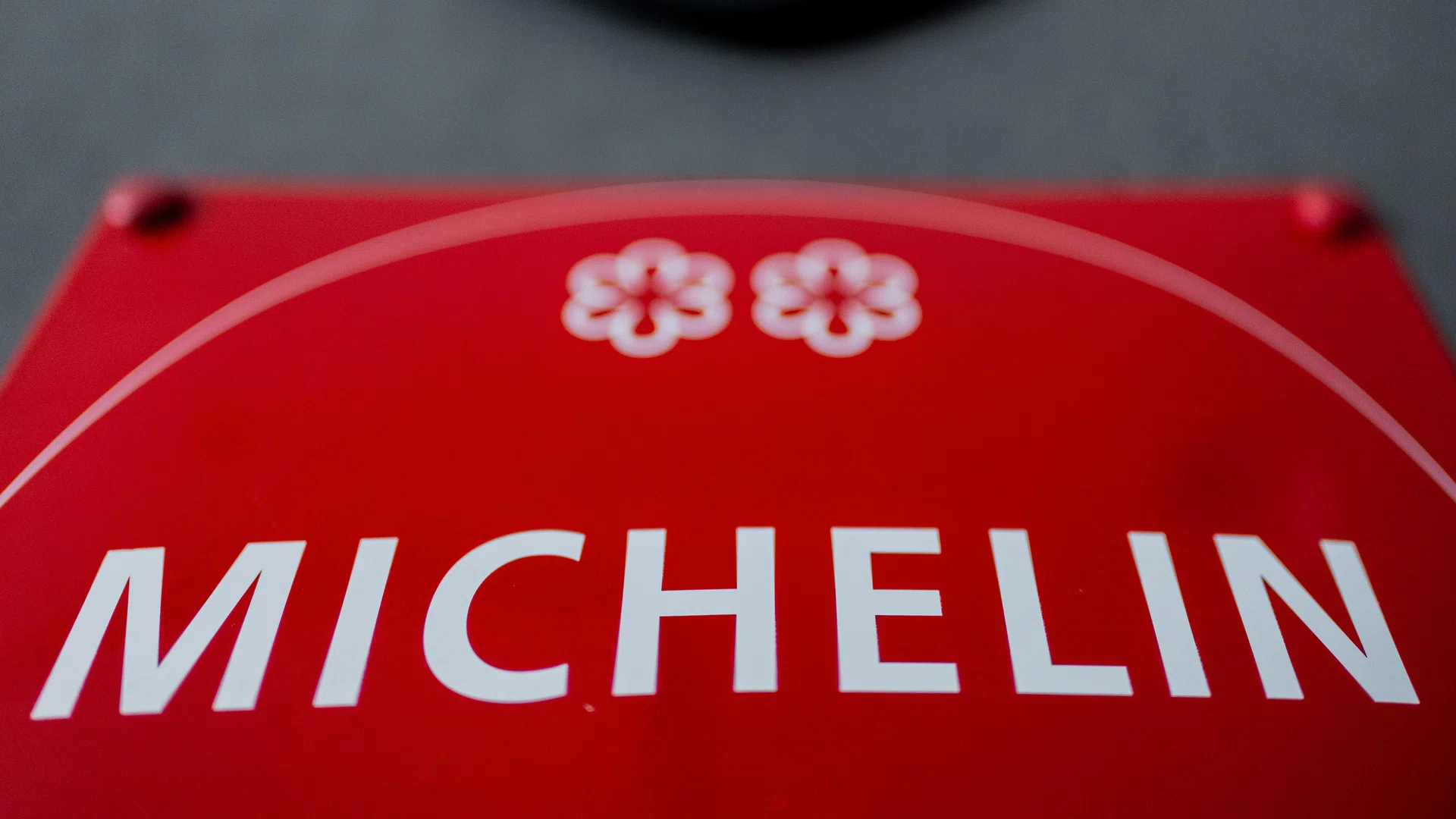 PRODUCTION - 26 June 2025, North Rhine-Westphalia, Cologne: 2 Michelin stars can be seen on a Michelin Guide plaque in front of the kitchen of Michelin-starred chef Daniel Gottschlich's restaurant "Ox & Klee". Photo: Rolf Vennenbernd/dpa (Photo by Rolf Vennenbernd/picture alliance via Getty Images)