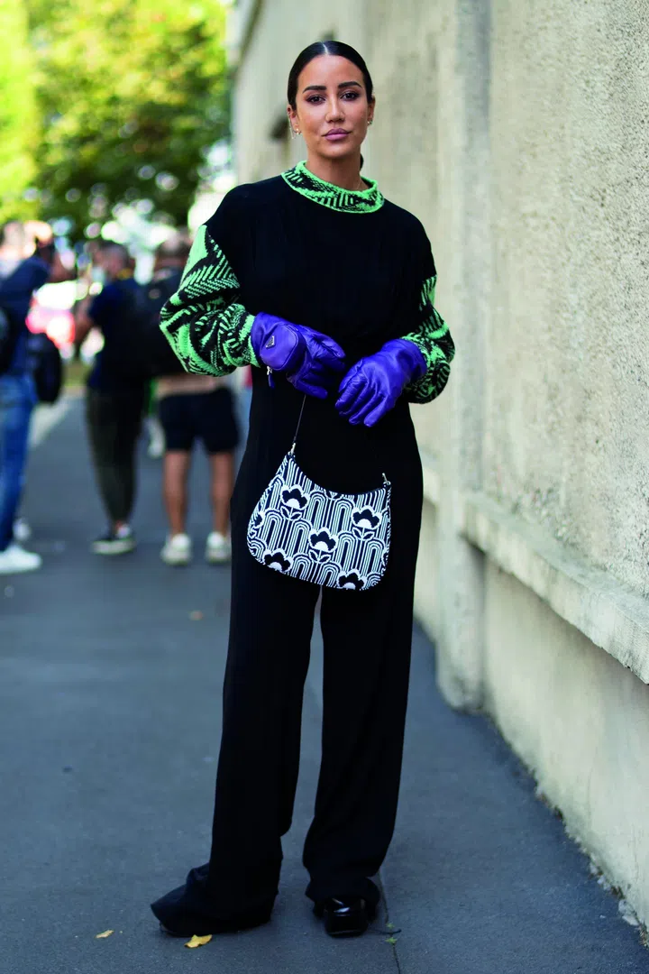 A fashion people in a Street Style photo out of Prada Spring Summer 2022 Women Ready to Wear Fashion Show on September 2021 in Milan, IT