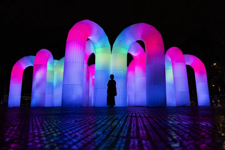 Overview of Sky Castle, an installation by ENESS, a multi-award-winning art and technology studio, at Cathay Green on Aug 19, 2025. This interactive sound-and-light work features a vibrant cluster of inflatable arches that create a colourful symphony. 