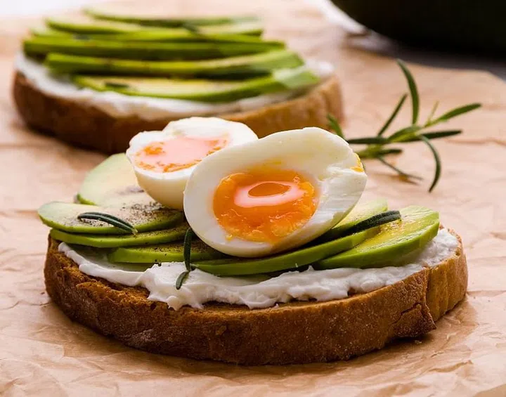 fresh sliced avocado and boiled egg sandwich
