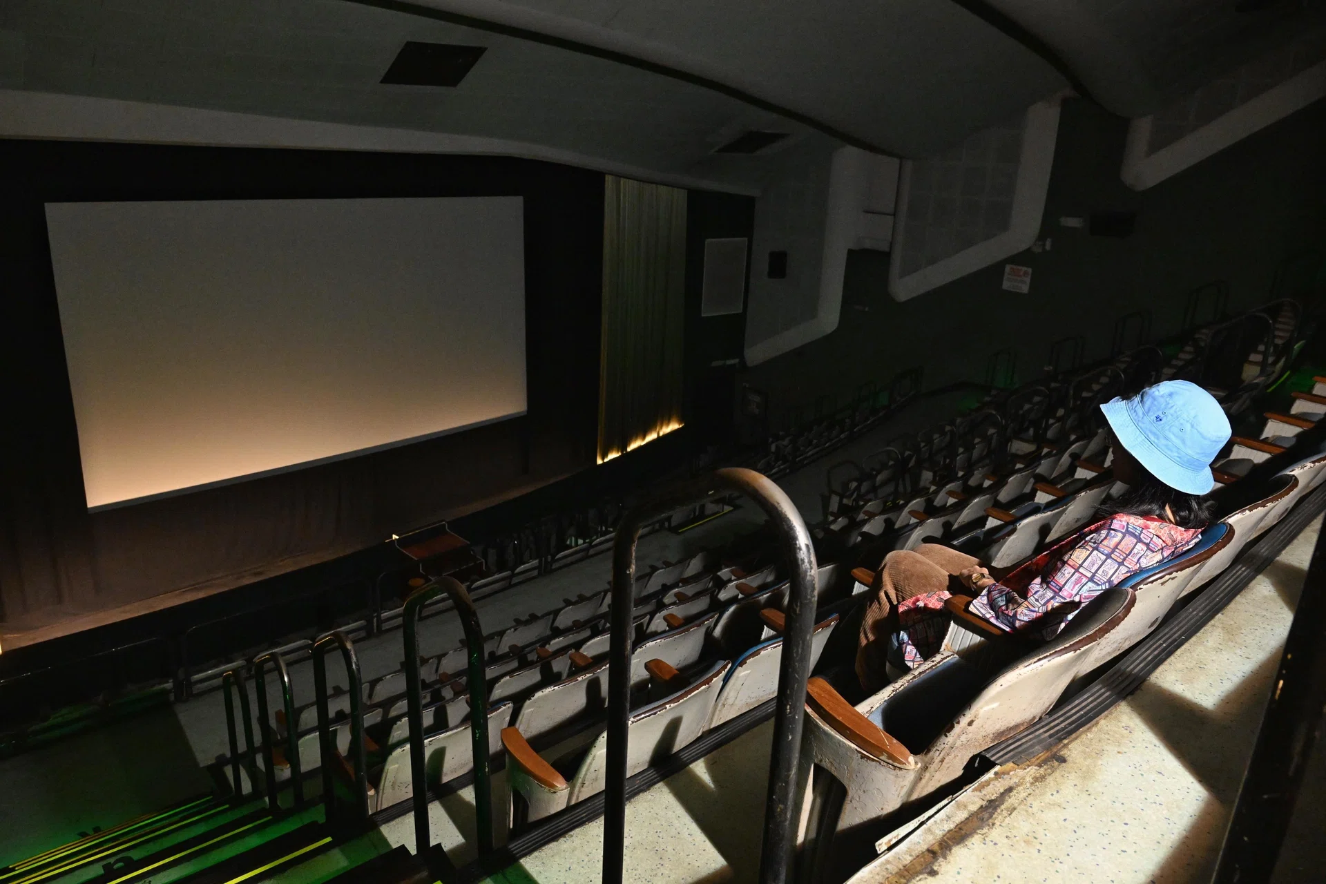 Film buff Adora Tan, 28, reminiscing her movie experiences at The Projector on Aug 19. She visited the cinema upon receiving news of its closure.