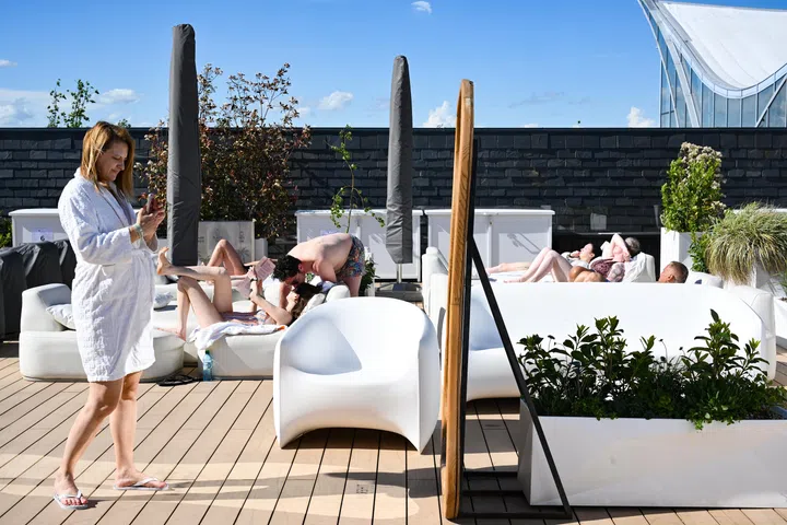 [Embargoed till June 19, 2026] ST20260510-202624300559-Lim Yaohui-Christine Tan-chthermexx/ Visitors relaxing in Elysium's outdoor terrace at Therme Bucharest in Romania on May 12, 2026. It is the largest relaxation, wellness and entertainment centre in Europe based on thermal waters. Located just 10 minutes from Bucharest, it has become one of Romania’s most popular attractions since opening in 2016, welcoming more than 8 million visitors to date. Therme Singapore will be Therme Group’s first project in Southeast Asia and Asia’s first large-scale wellbeing destination of its kind. Located on a four-hectare waterfront site adjacent to Gardens by the Bay and Marina Barrage, the development is expected to become a major addition to Singapore’s Marina Bay precinct and wider tourism landscape. In November 2025, Therme Group was awarded the tender by the Singapore Tourism Board to develop the site. The project is expected to involve an investment of approximately S$1 billion and is projected to welcome around two million visitors annually when it reaches full operational capacity, and is slated to open in 2030. (ST PHOTO: LIM YAOHUI)