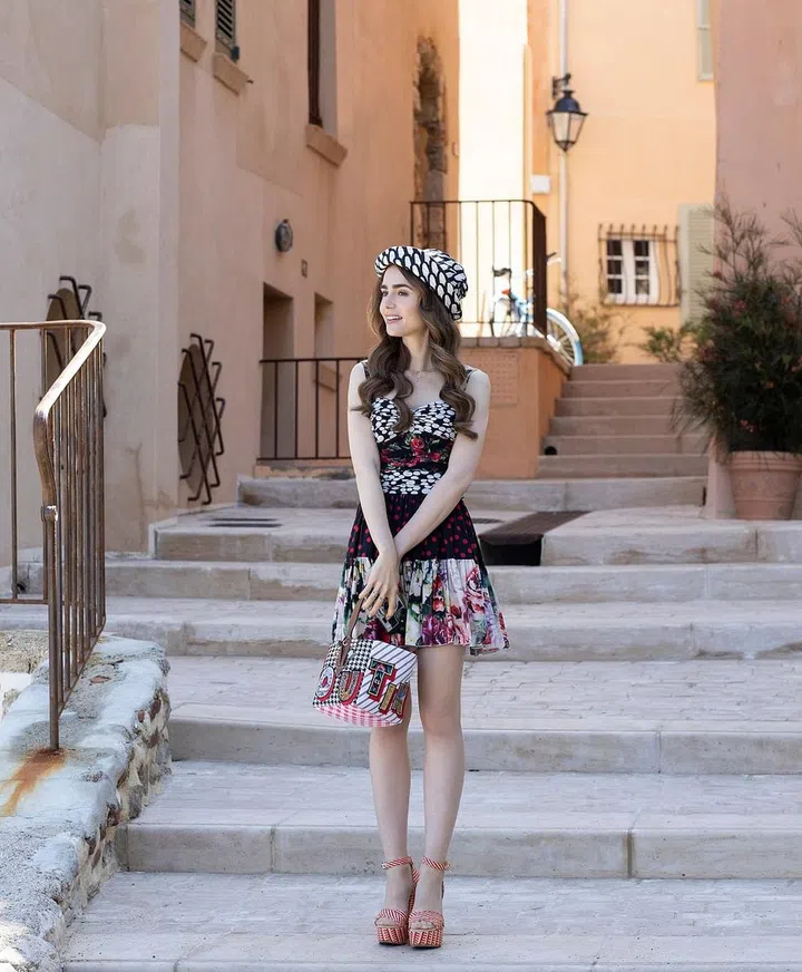 Emily in Paris. Lily Collins as Emily in episode 202 of Emily in Paris. Cr. Carole Bethuel/Netflix © 2021