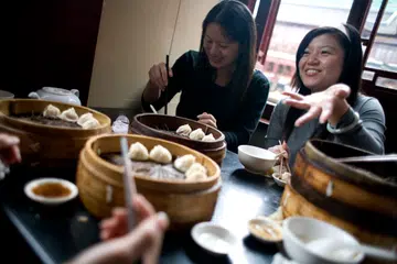 Image of women having food together