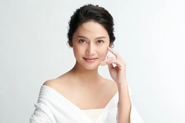Beautiful young asian woman with clean fresh skin on white background, Face care, Facial treatment, Cosmetology, beauty and spa, Asian women portrait.