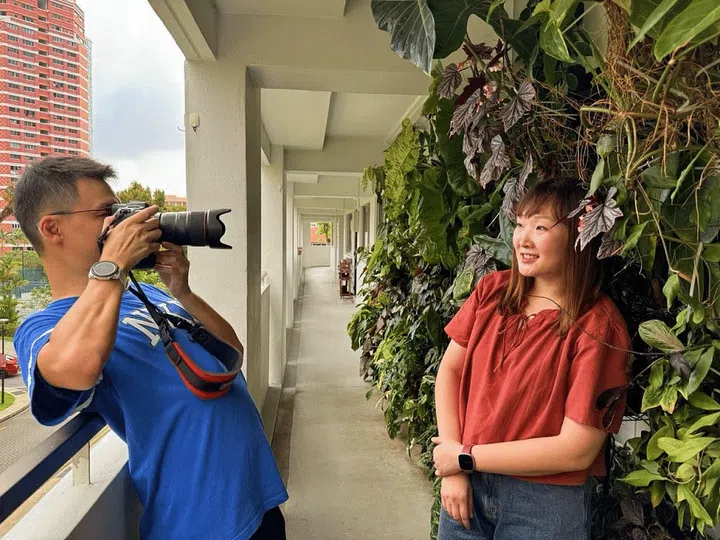 Since the end of 2020, Koh Jin Da (left) and Daisy started buying plants. Now, outside their home, there are 2 sides of a ‘plant wall’ consisting of more than 10 shelves each, with nearly 200 pots of plants on them. (Photo by Cai Weiqian)