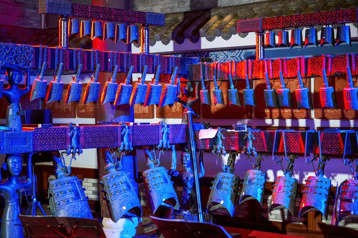 A group of large traditional Chinese chimes on the stage of the concert hall