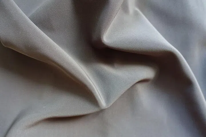 94281268 - crumpled dark grey viscose, cotton and polyester fabric