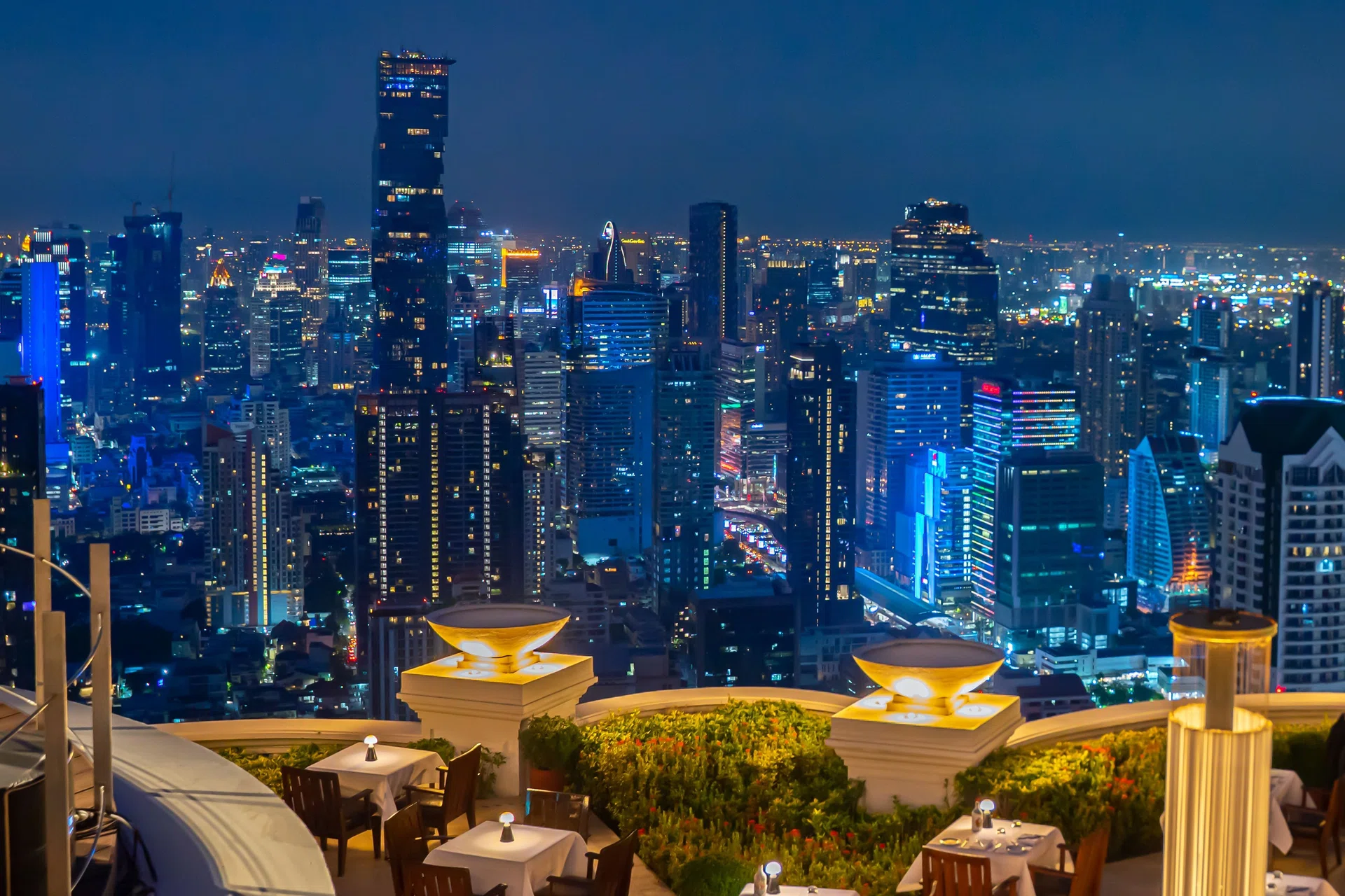 Top view of night Bangkok skyline from the Mezzaluna restaurant, Lebua hotel, State Tower, Thailand. (Photo by: ruelleruelle/UCG/Universal Images Group via Getty Images)