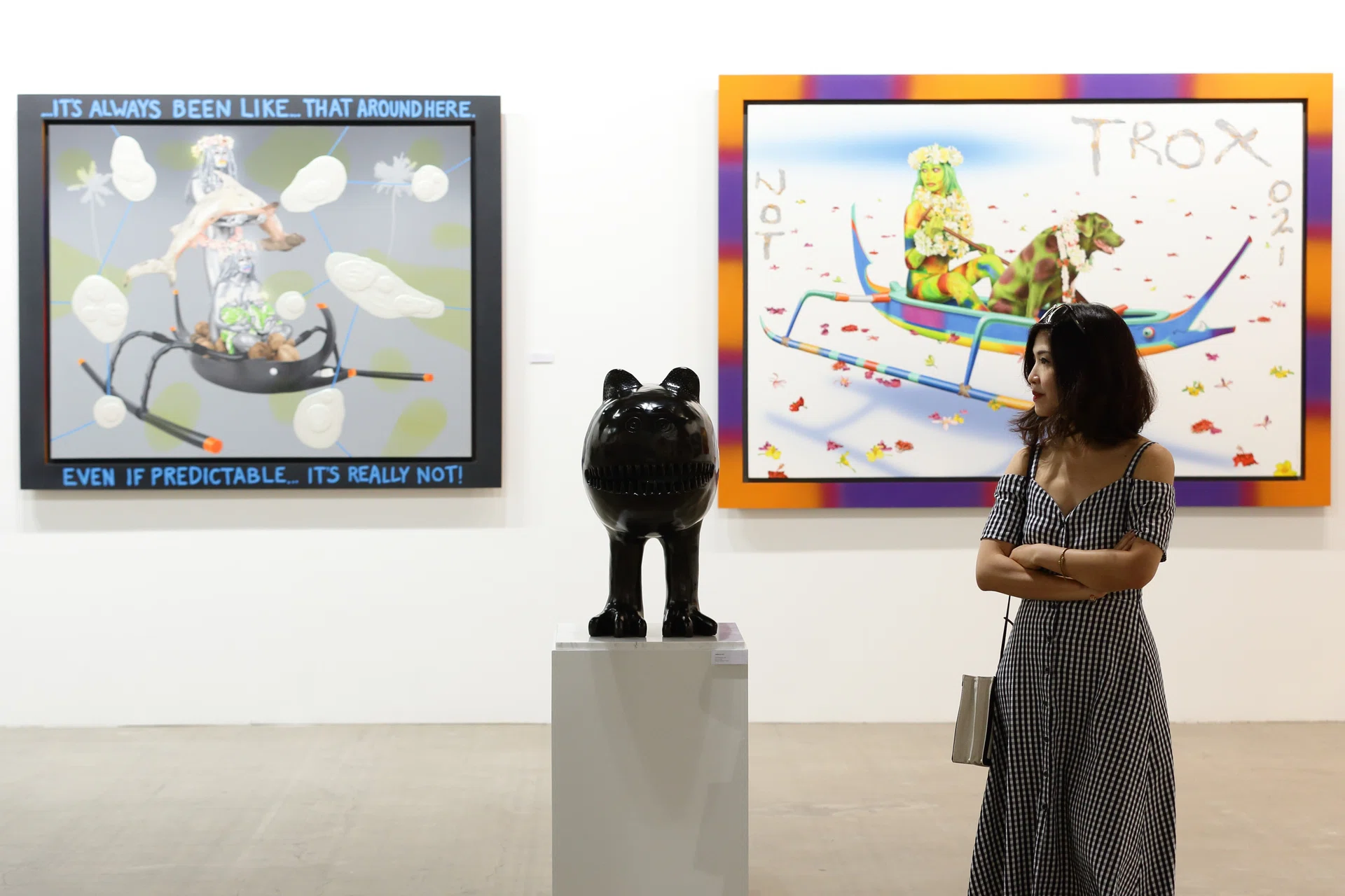 SINGAPORE - JANUARY 25:  A lady takes a look at Indonesian artist, Yunizar bronze sculpture, titled 'Little Monster' at Marina Bay Sands Expo and Convention Centre on January 25, 2018 in Singapore. ART STAGE Singapore returns in 2018 for its eighth edition from 26 to 28 January 2018.  (Photo by Suhaimi Abdullah/Getty Images)