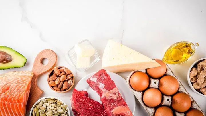 Ketogenic low carbs diet concept. Healthy balanced food with high content of healthy fats. Diet for the heart and blood vessels. Organic food ingredients, white marble background, copy space top view