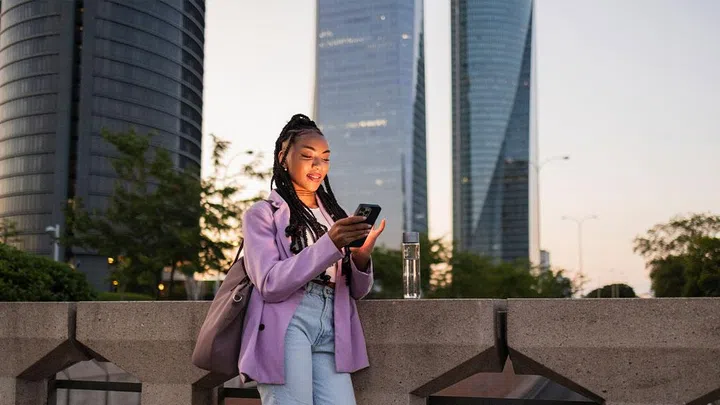 woman using phone to check message